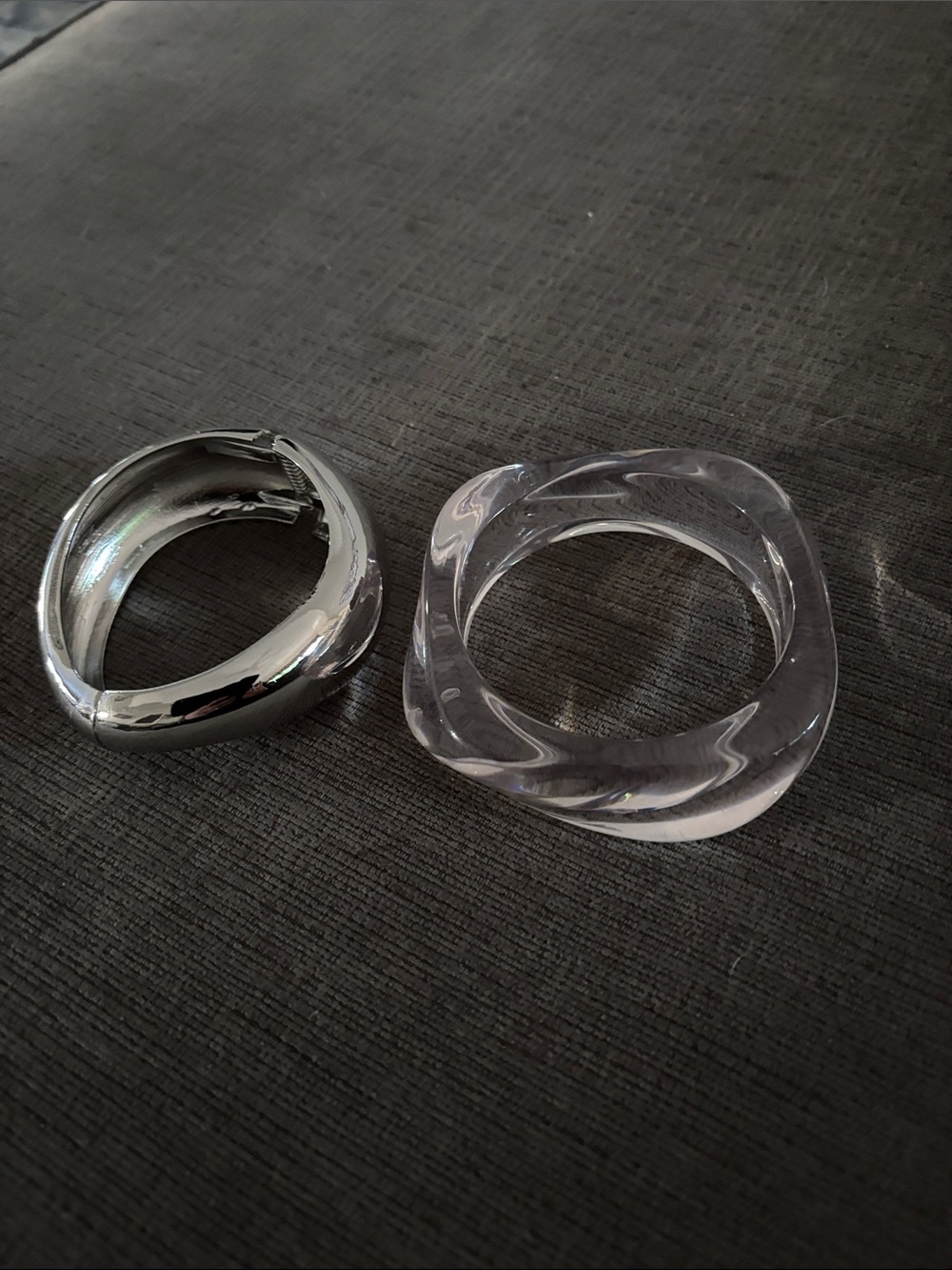 Silver bracelet with hinge closure and clear slip
On bracelet.